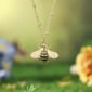 Bee_Pendant_Necklace_with_Nature-Inspired_Background